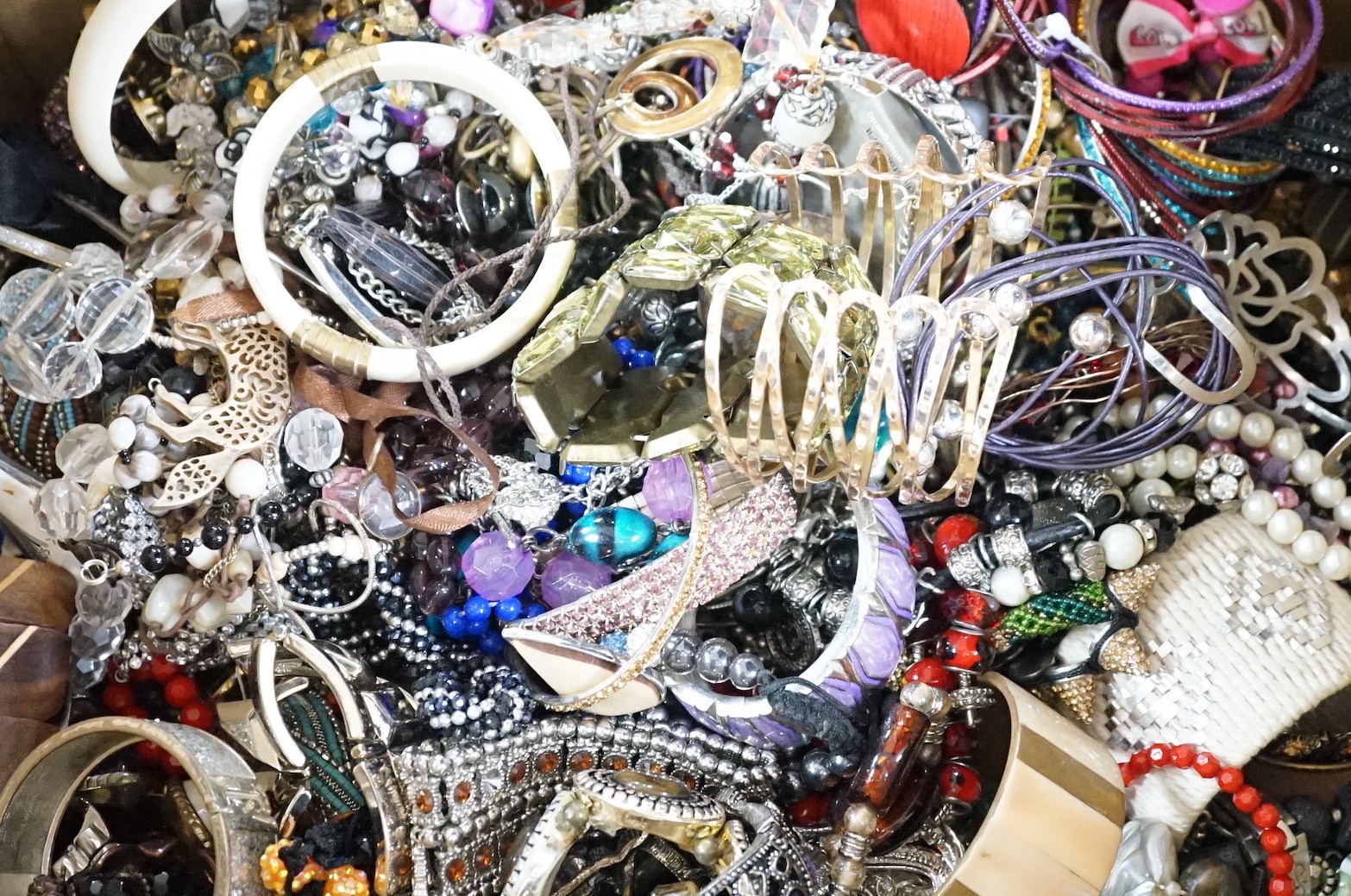 A large quantity of assorted bangles and other costume jewellery.